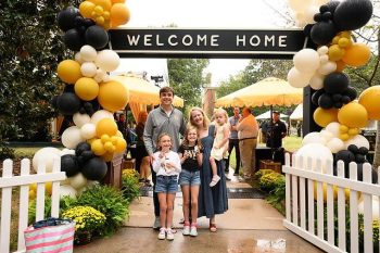 Wake Forest University alumni, family, and friends attend Party So Dear as part of Homecoming 2024 festivities on the Mag Quad on Friday, September 13, 2024.   Matt Six, ('09) and his wife Nicole Six, and their three kids Elizabeth (9), Abigail (6), and Isabel (4) pose for a photo together.