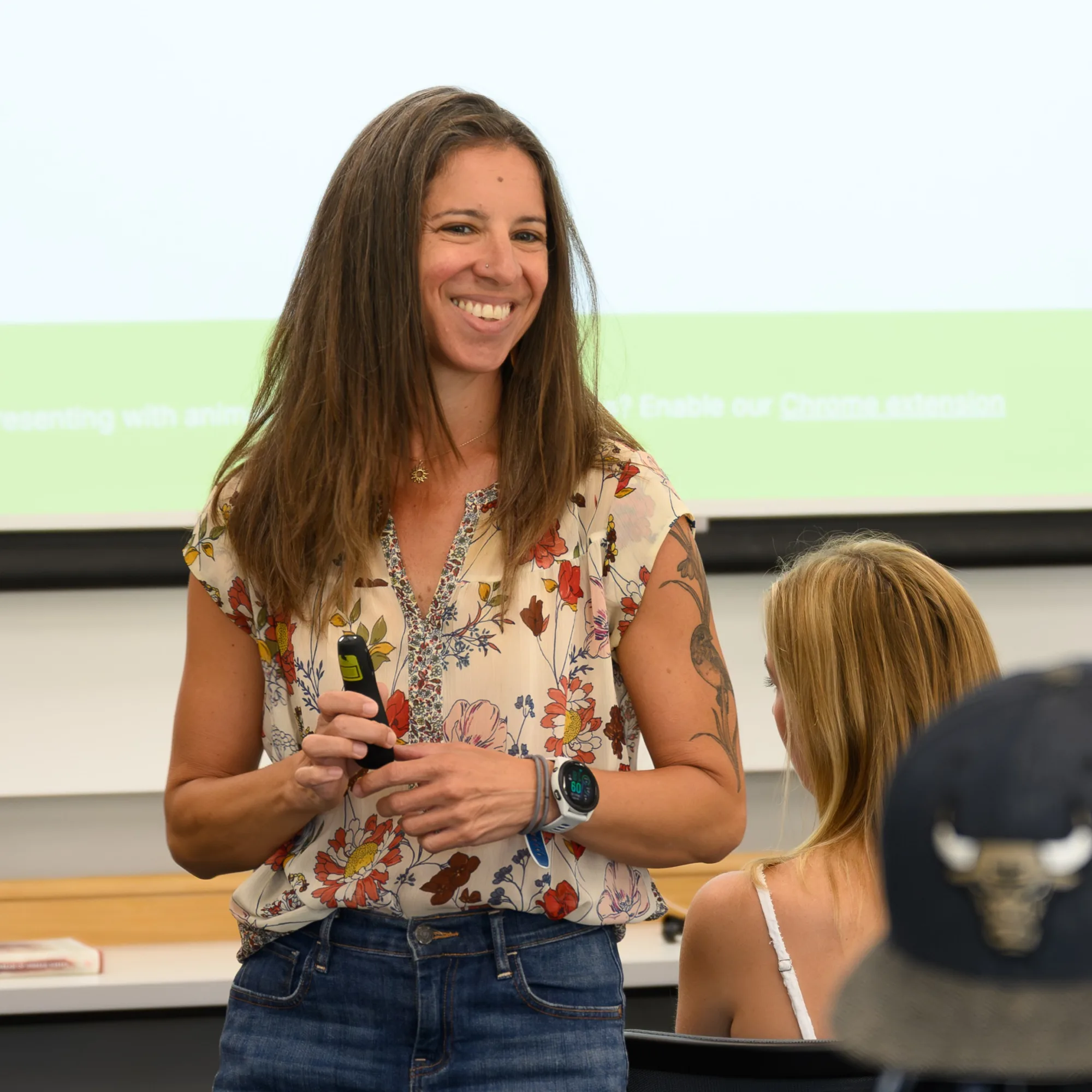 A photo of a woman, Dr. Maffeo, standing in a classroom teaching students.