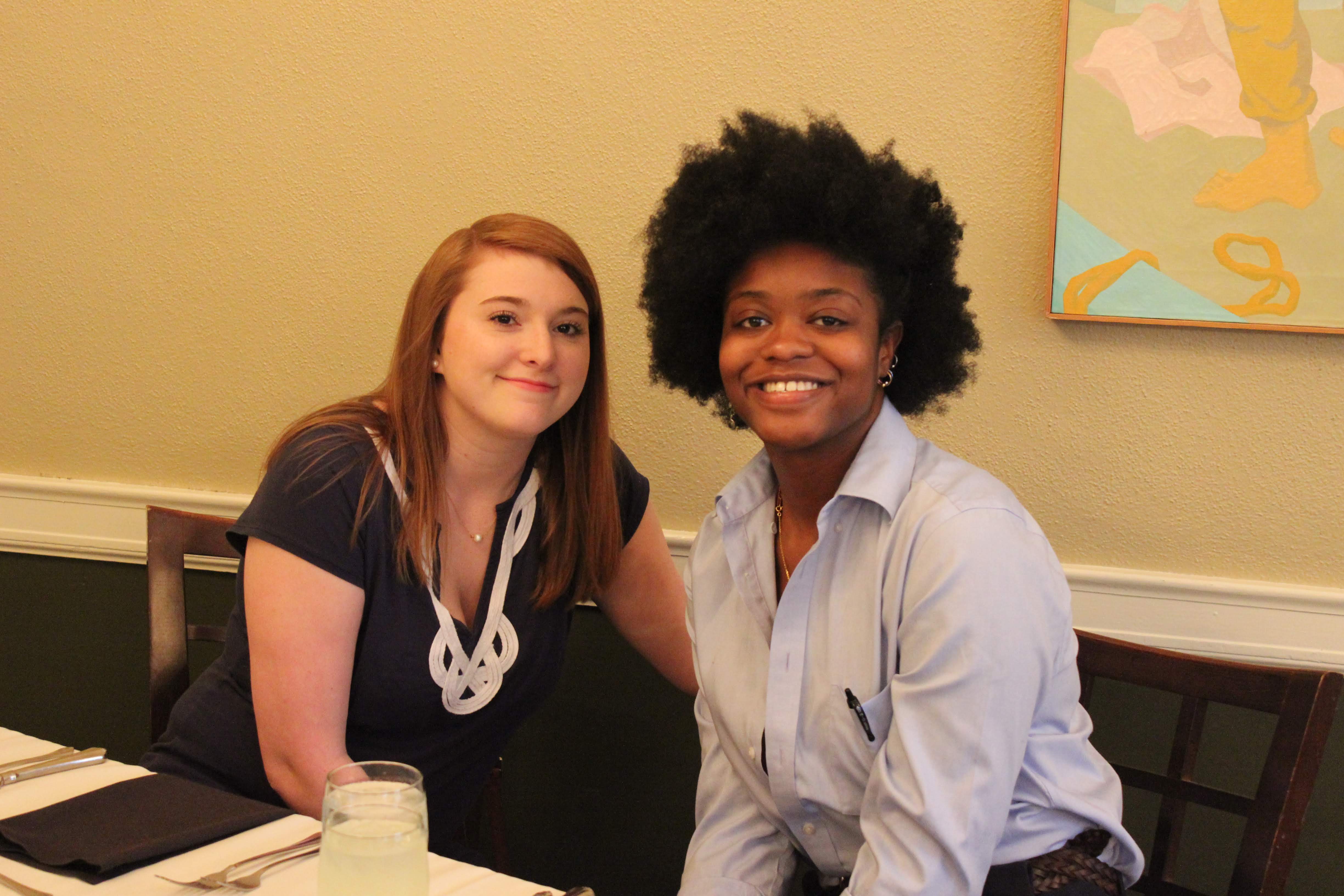 Two students smiling at camera