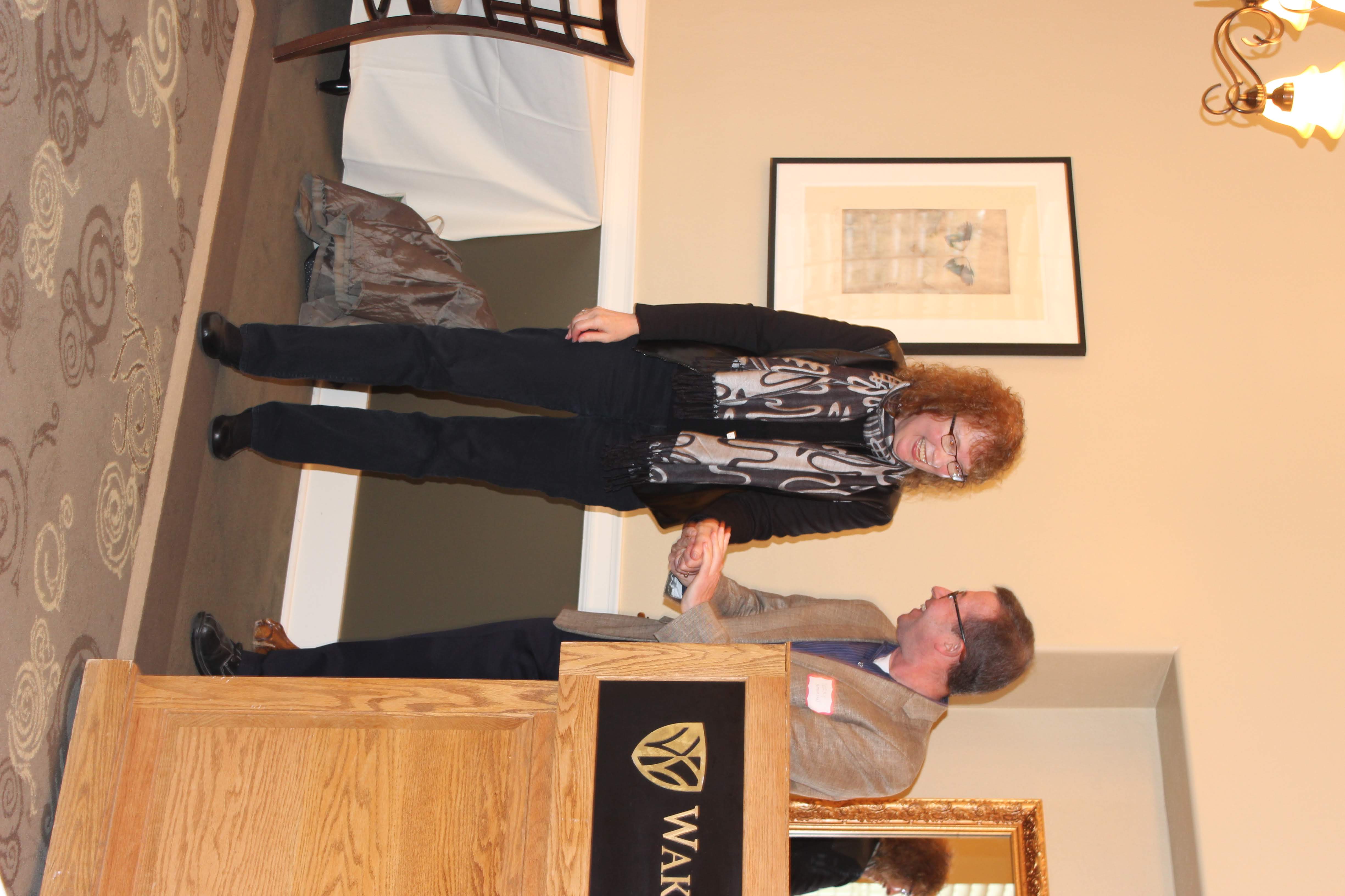 Dr. Mary DeShazer accepting appreciation