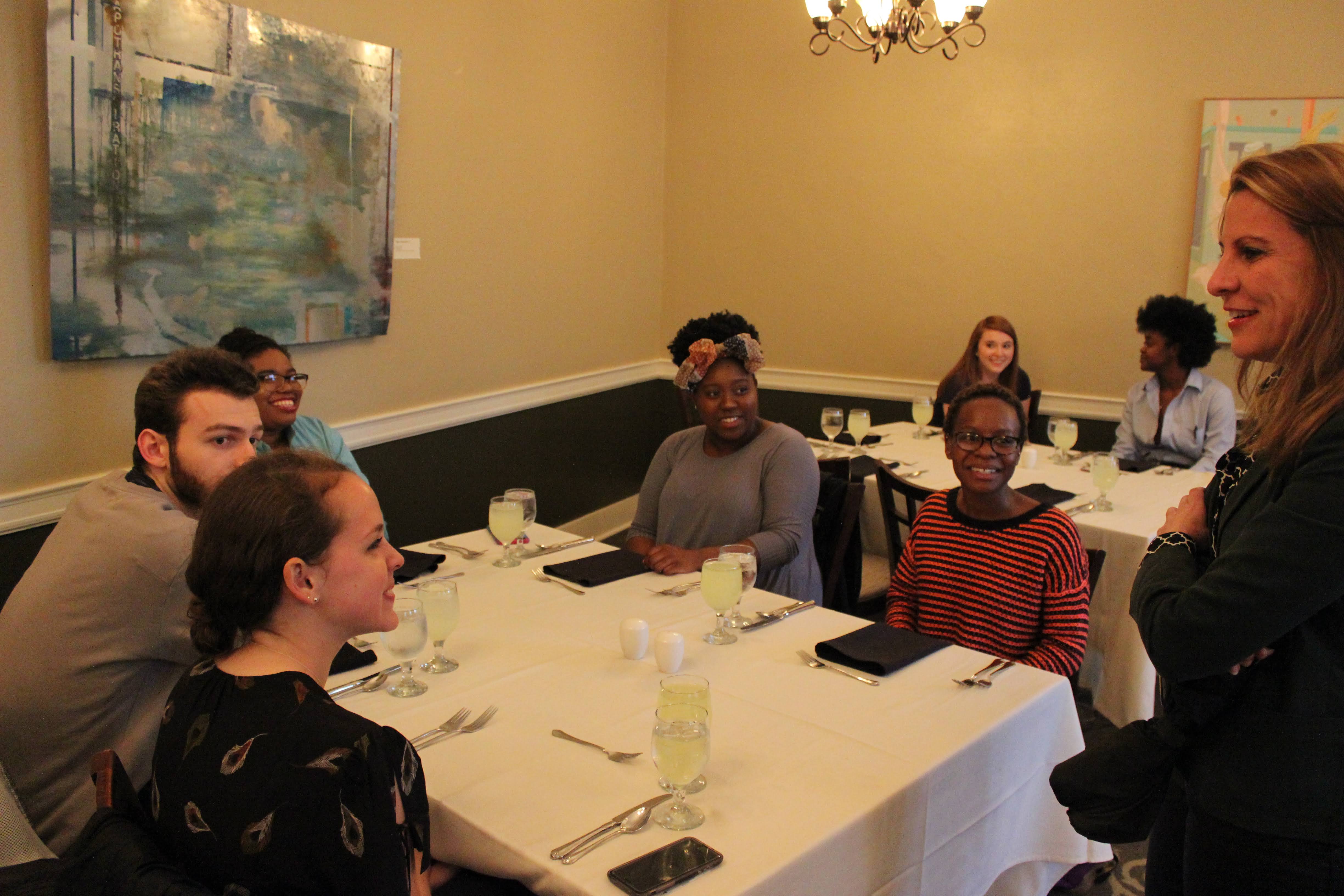 Students sitting at dining table talking