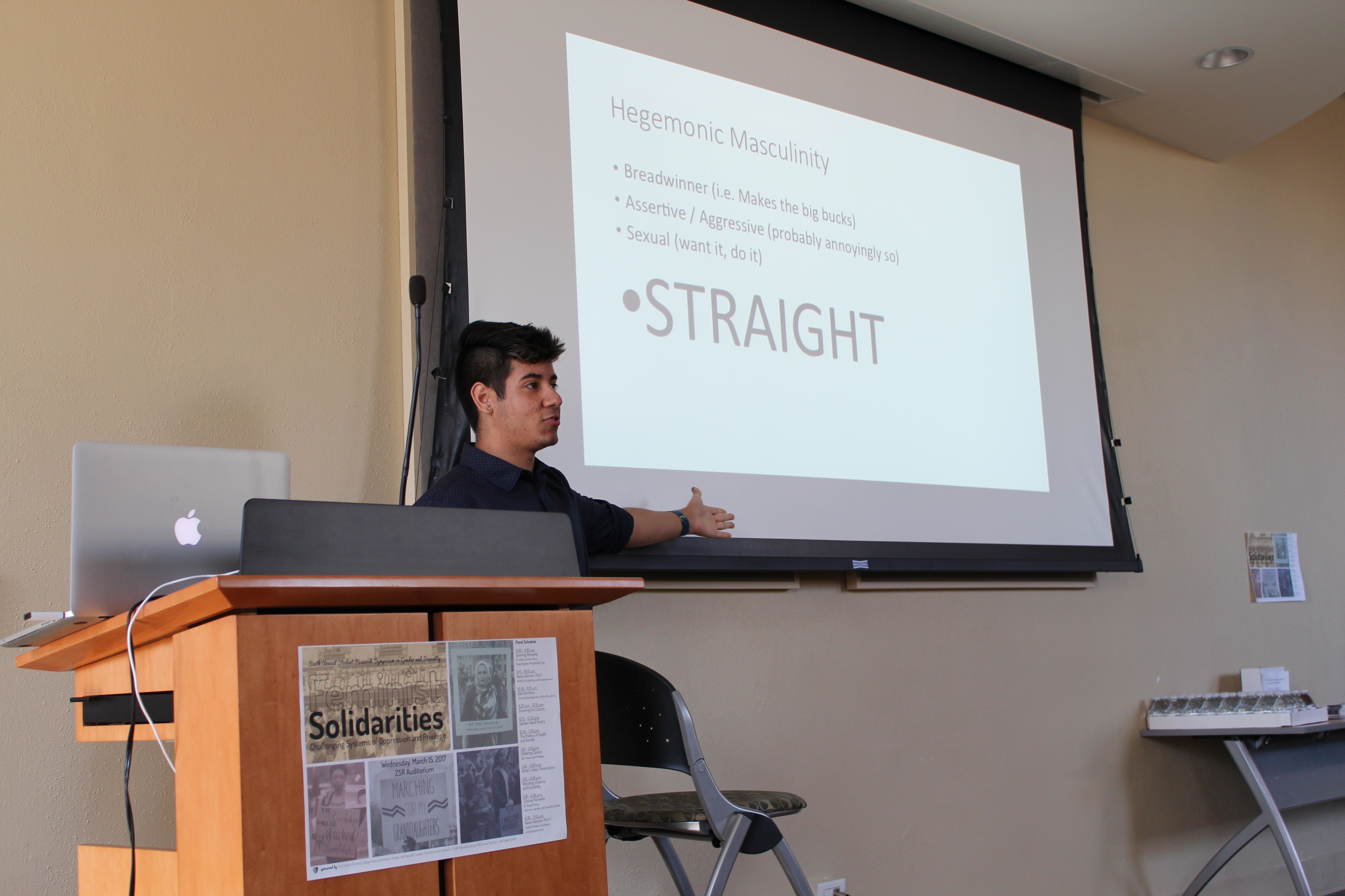 Student giving presentation at symposium