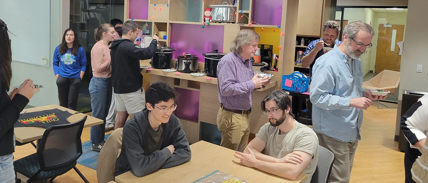 Faculty and students having chili in the Math and Stats Center