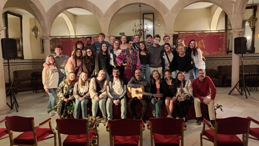 Students posing with professors and Spanish musicians after a performance in Salamanca, Spain.