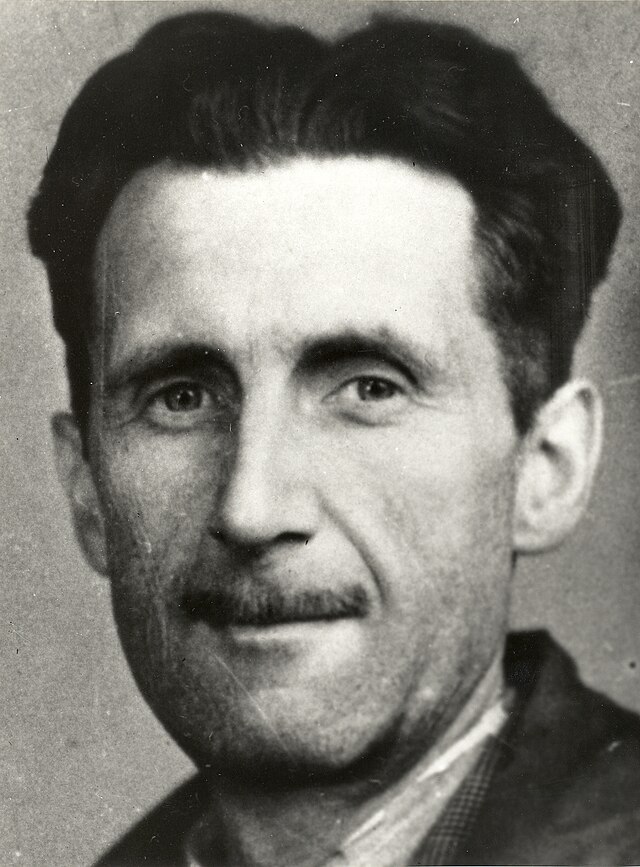 A black and white image of George Orwell from the shoulders up.