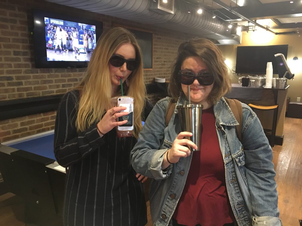 photo from department event featuring students wearing sunglasses