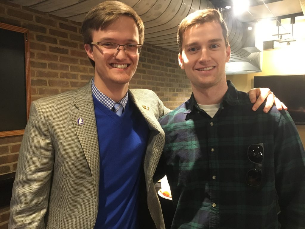 photo from department event featuring students wearing sunglasses
