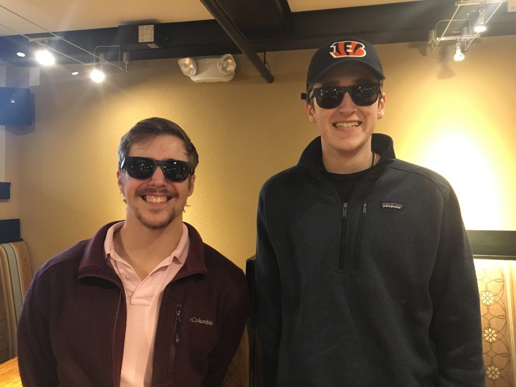 photo from department event featuring students wearing sunglasses