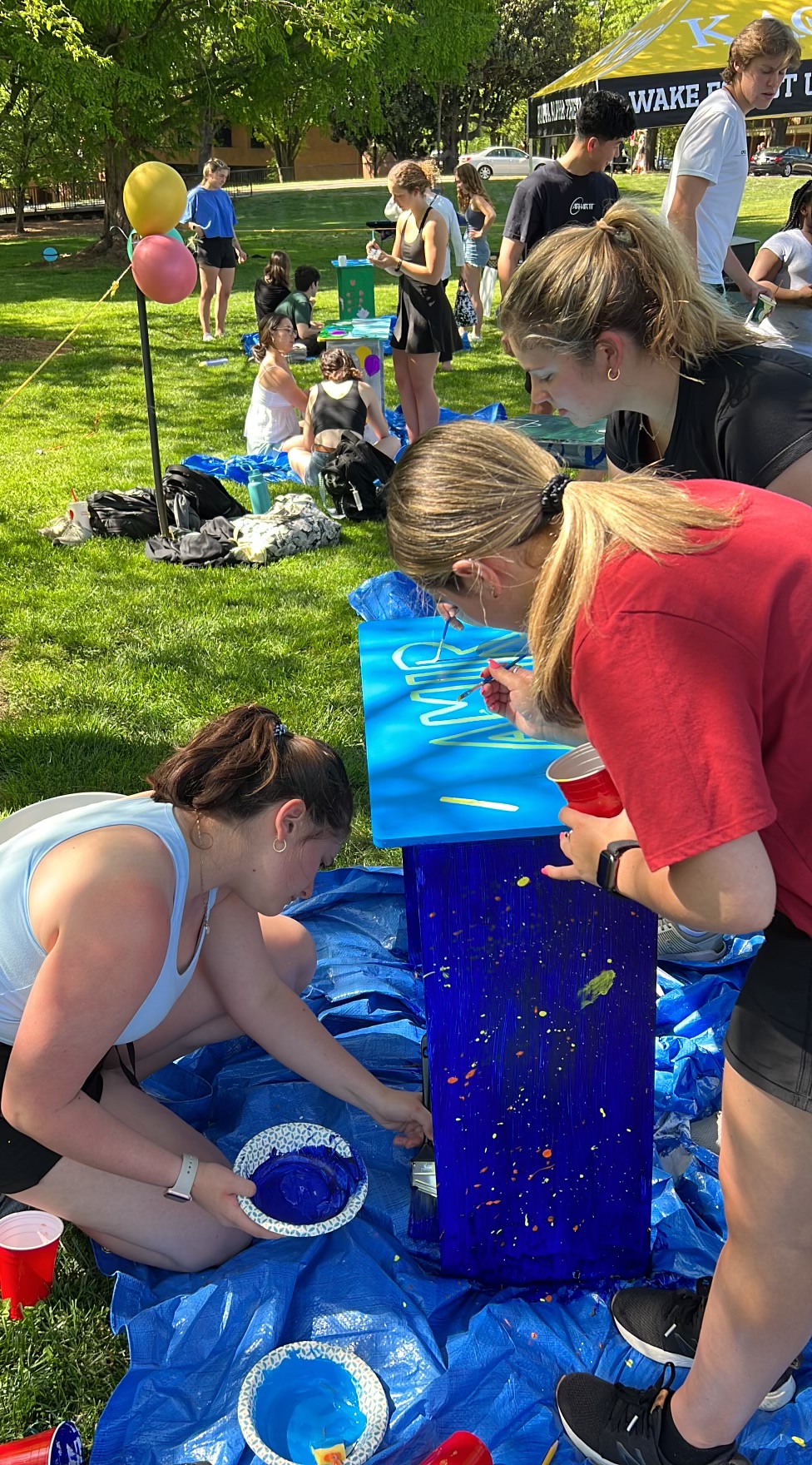 Students paint desks for Project DESK