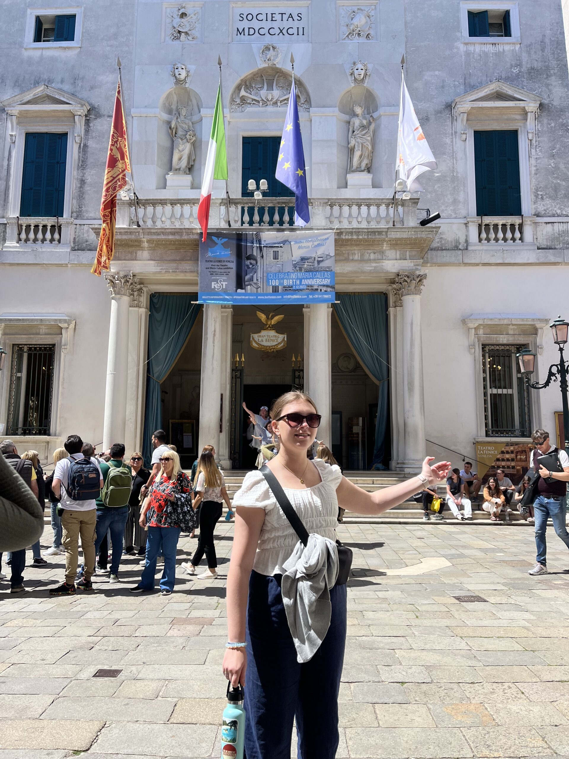 A student poses in front of Teatro La Fenice in Venice in 2023. 