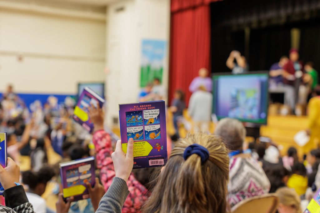 Children holding books