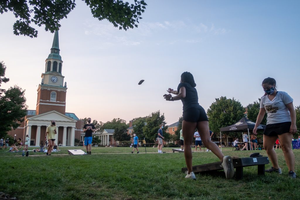 Wake Forest Students play corn hole on Hearn Plaza