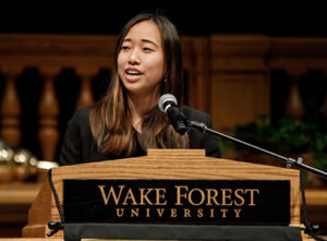 Celia Zhou speaks at the lectern