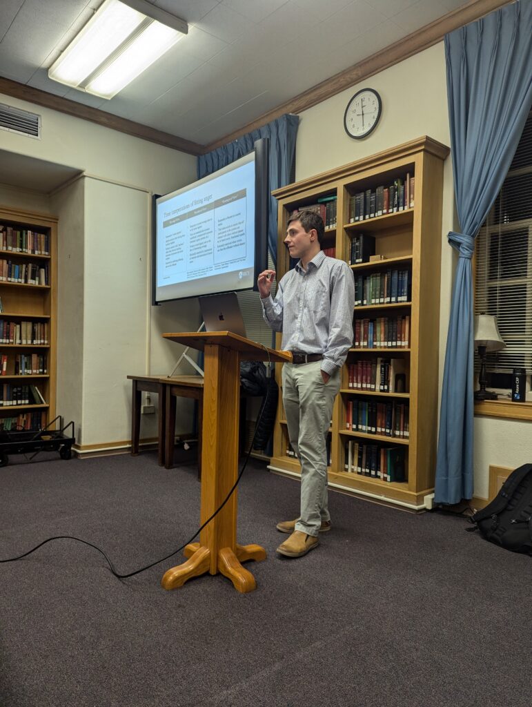 Samuel Reis-Dennis delivering a 2024 colloquium talk.