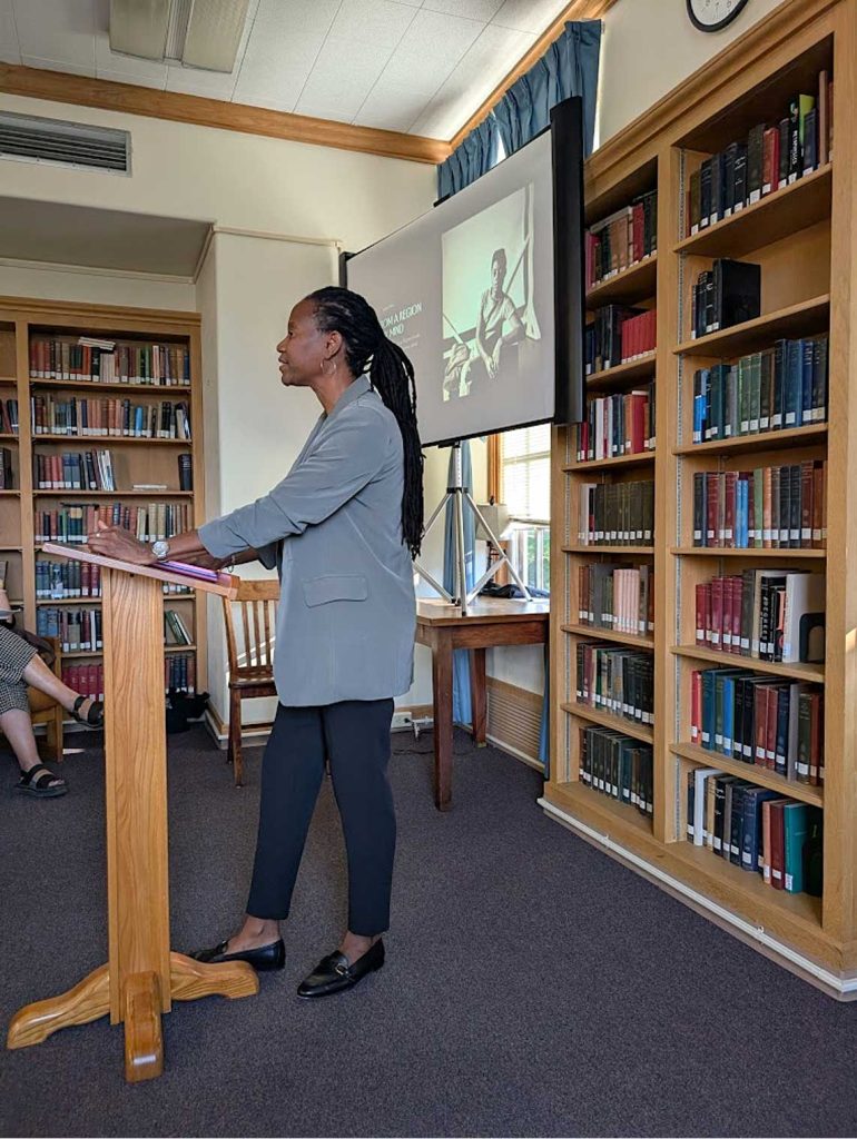 Myisha Cherry delivering a 2025 colloquium talk.