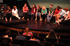 Cast members of The Laramie Project gather after a performance with the audience