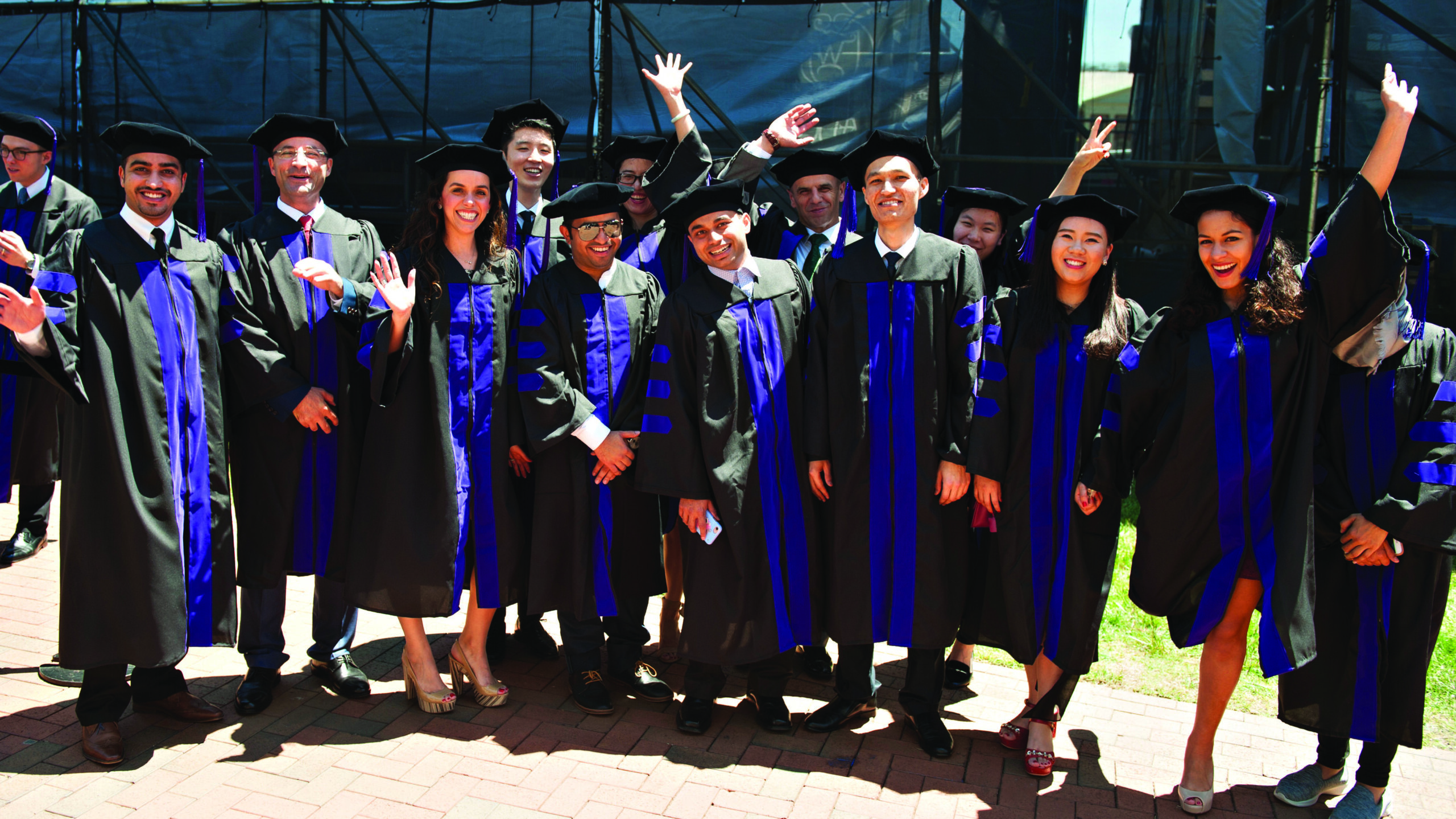 A large group of law school graduates at their graduation ceremony.