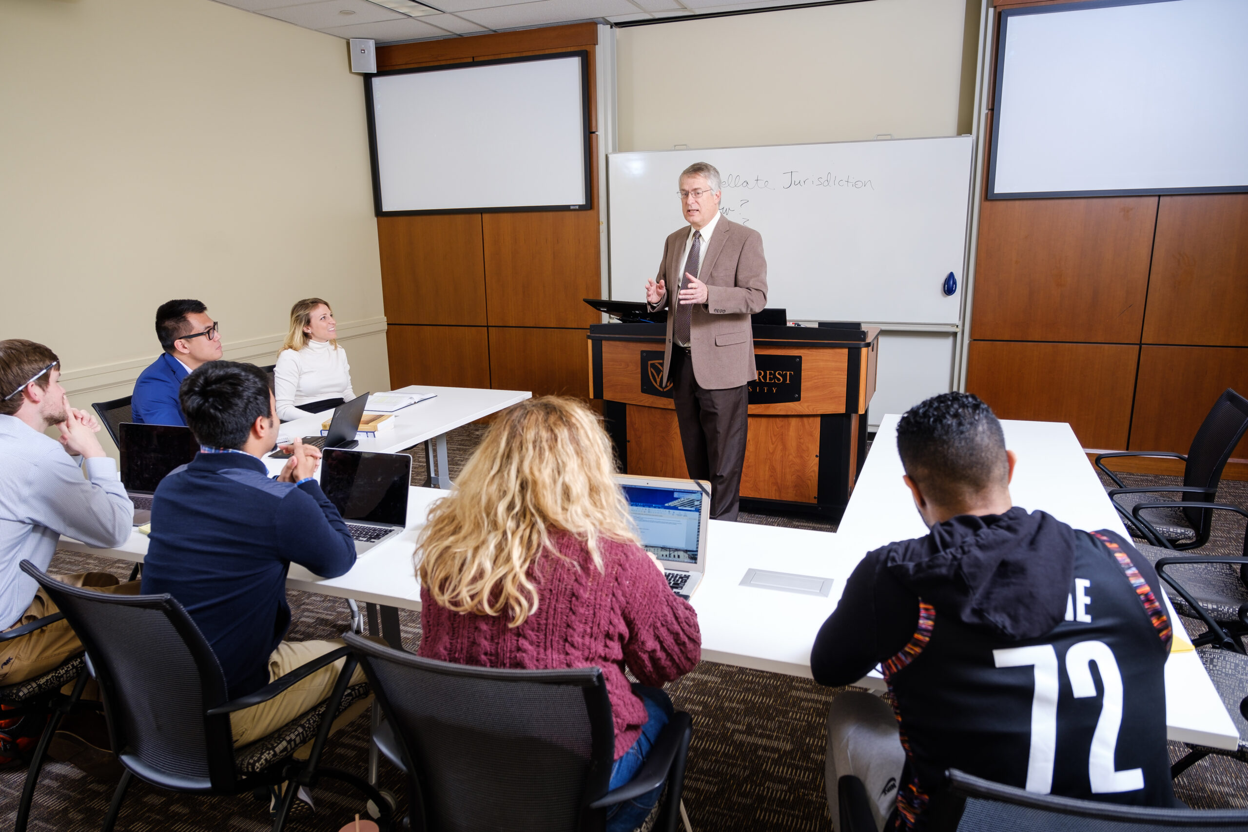 Wake Forest Law professor teaching to a small group of students.