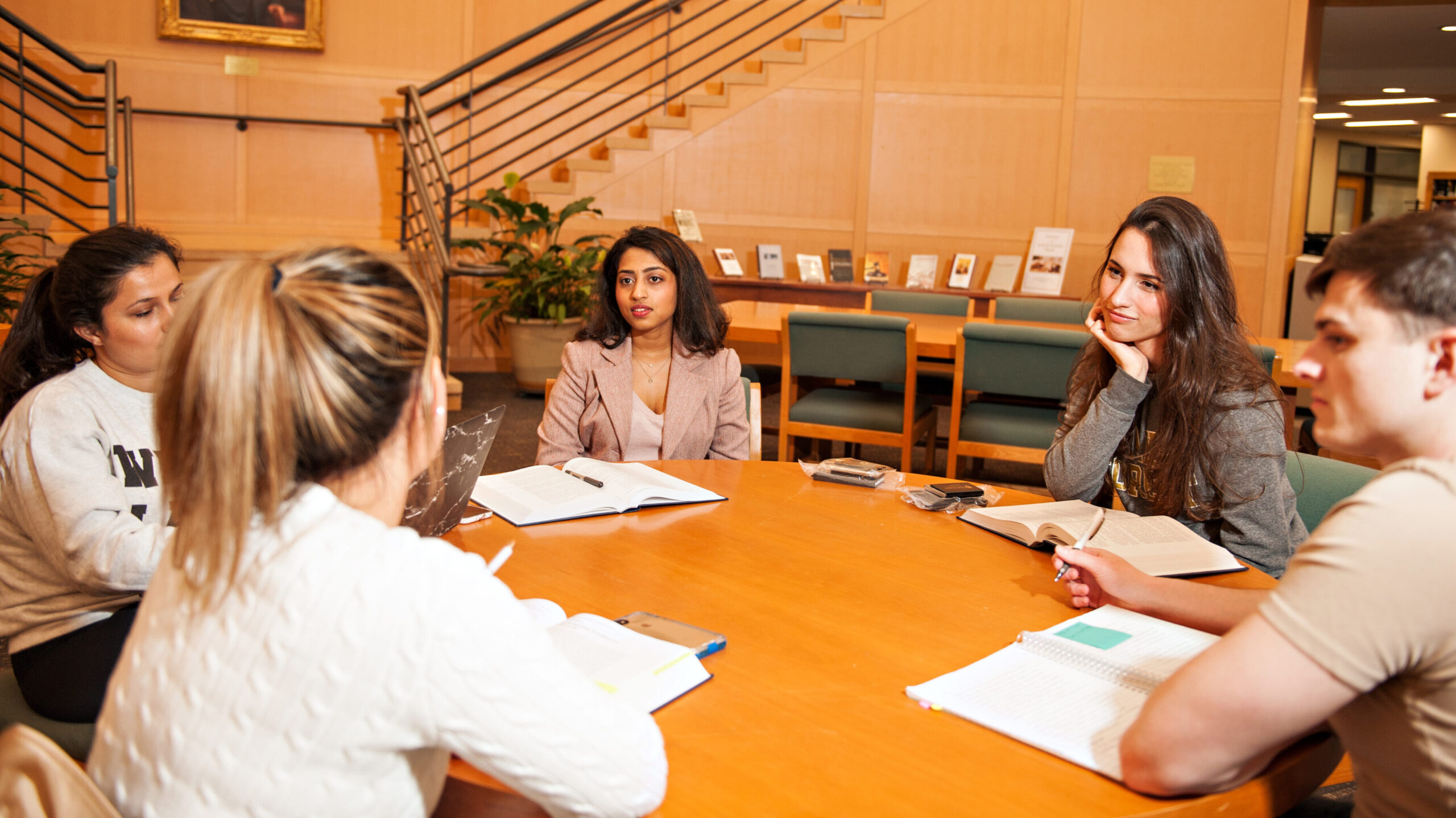 Group of five law school students studying together.