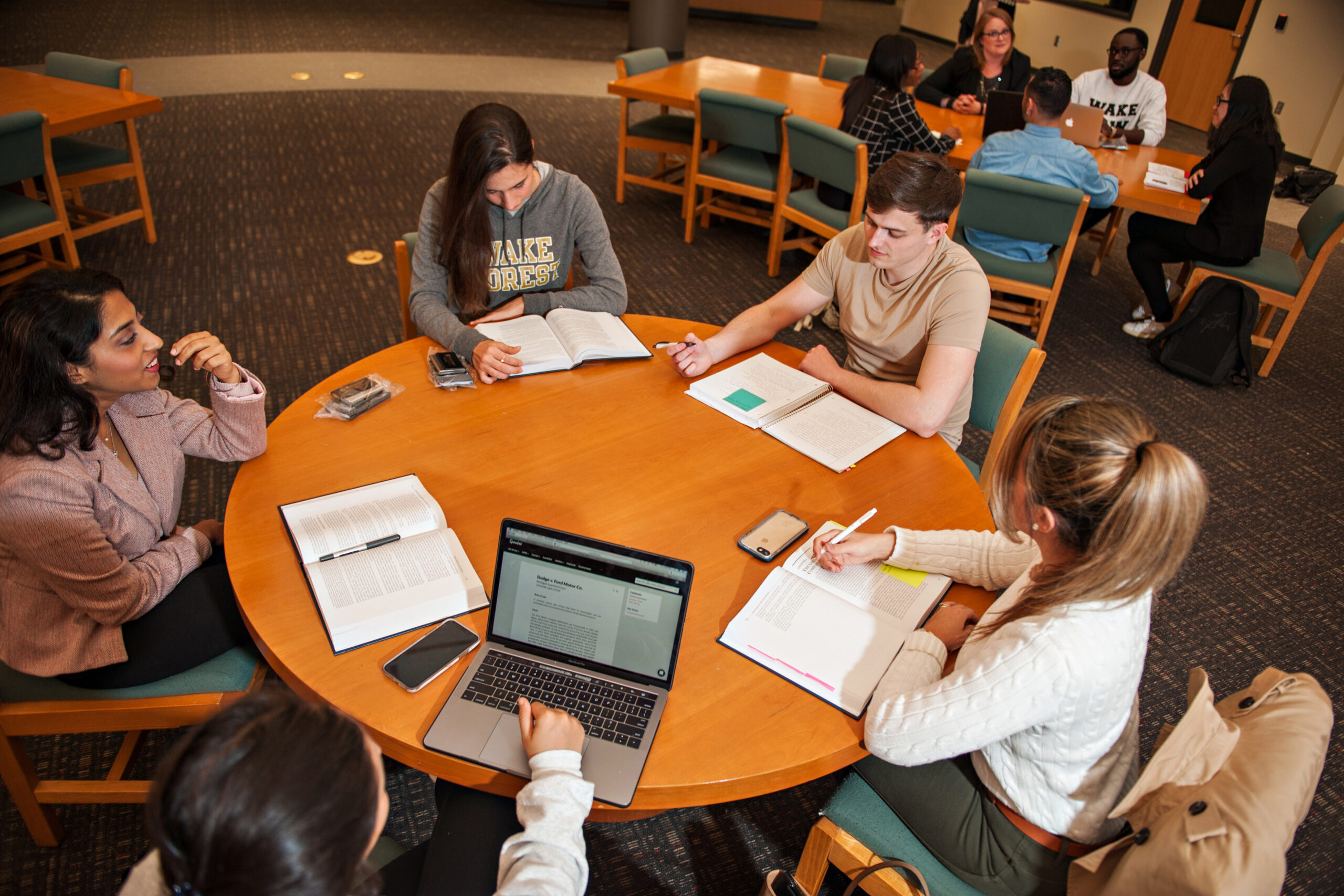 Five Wake Forest Law students studying at a round table.