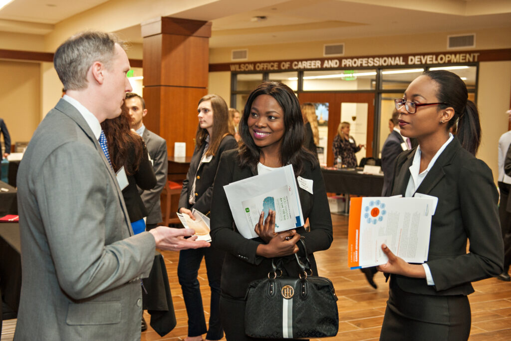 Two law school students at a career fair.