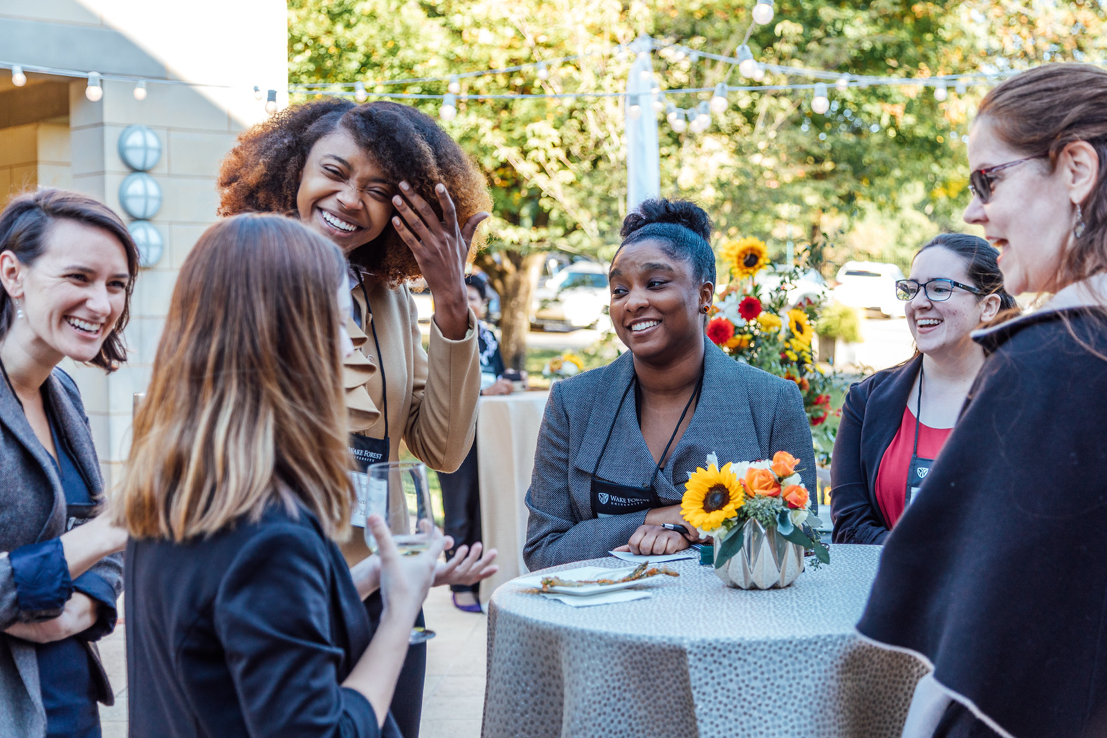 Women connect with each other at an alumni event