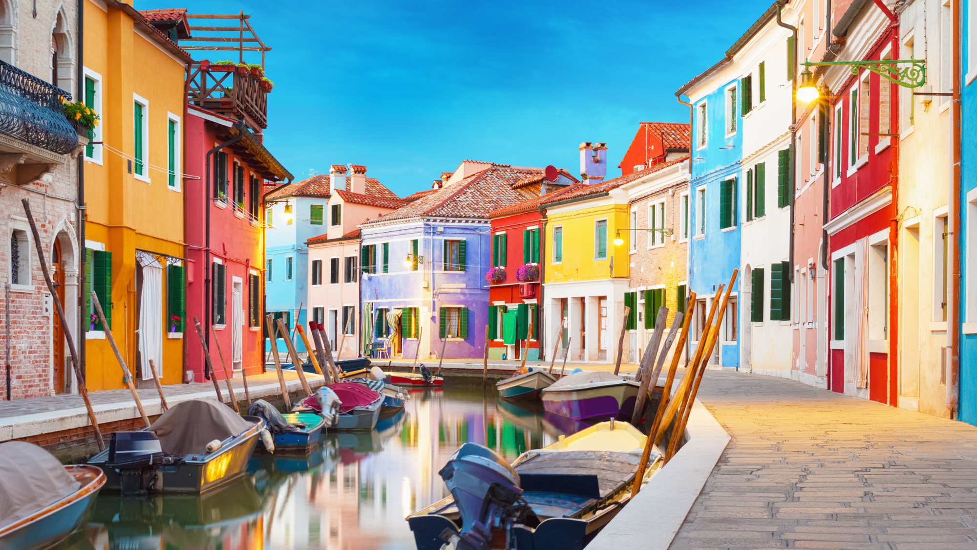 A painting of a canal in Venice, Italy during daytime.