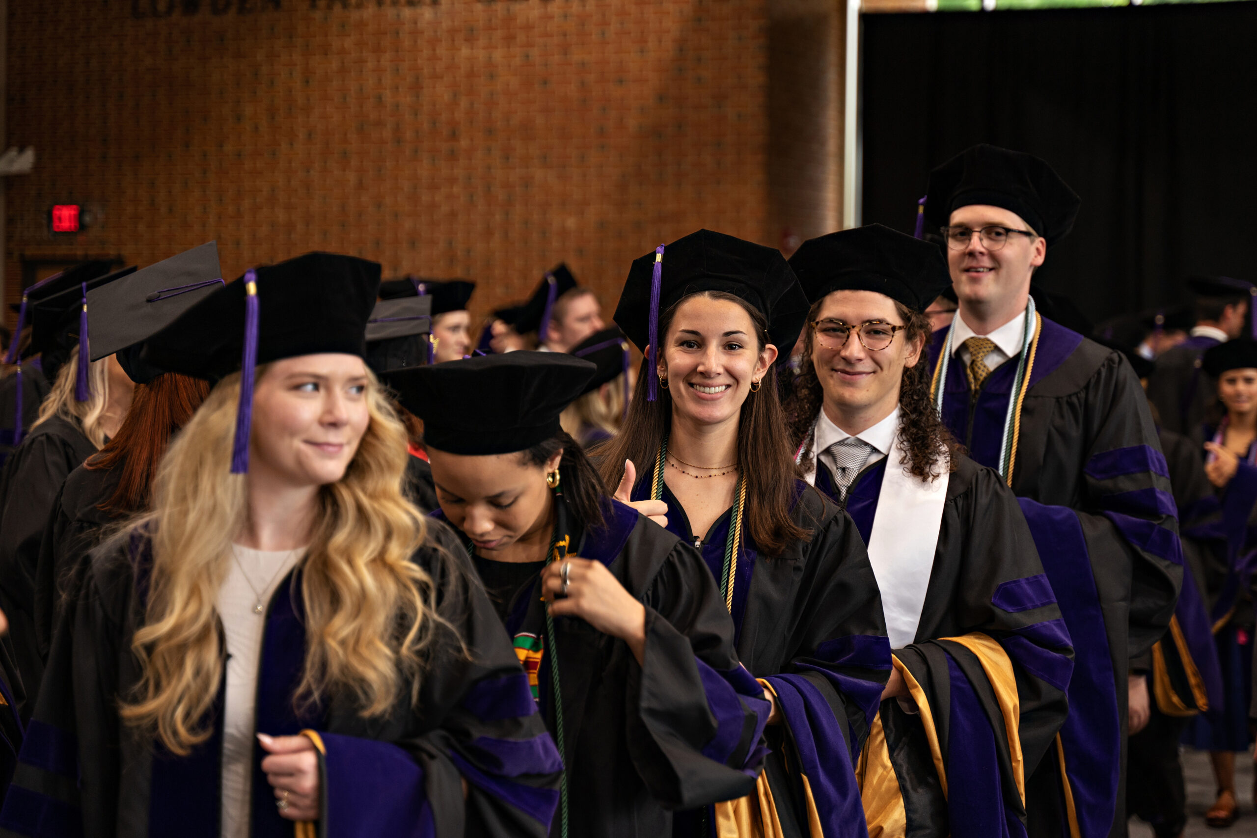 Wake Forest Law students in graduation garb at their graduation ceremony. 