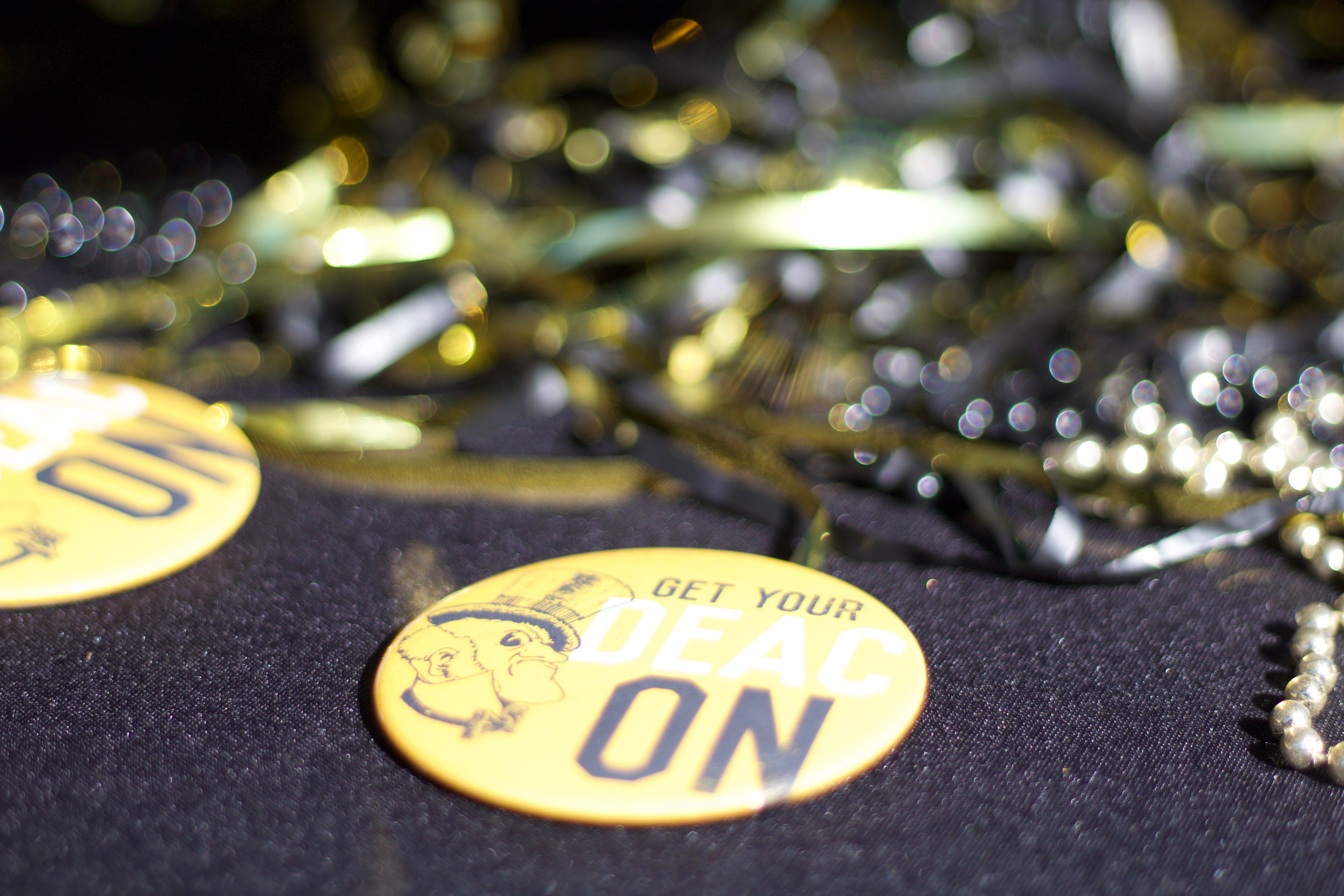 Wake Forest medallion placed in front of black and gold ribbons.