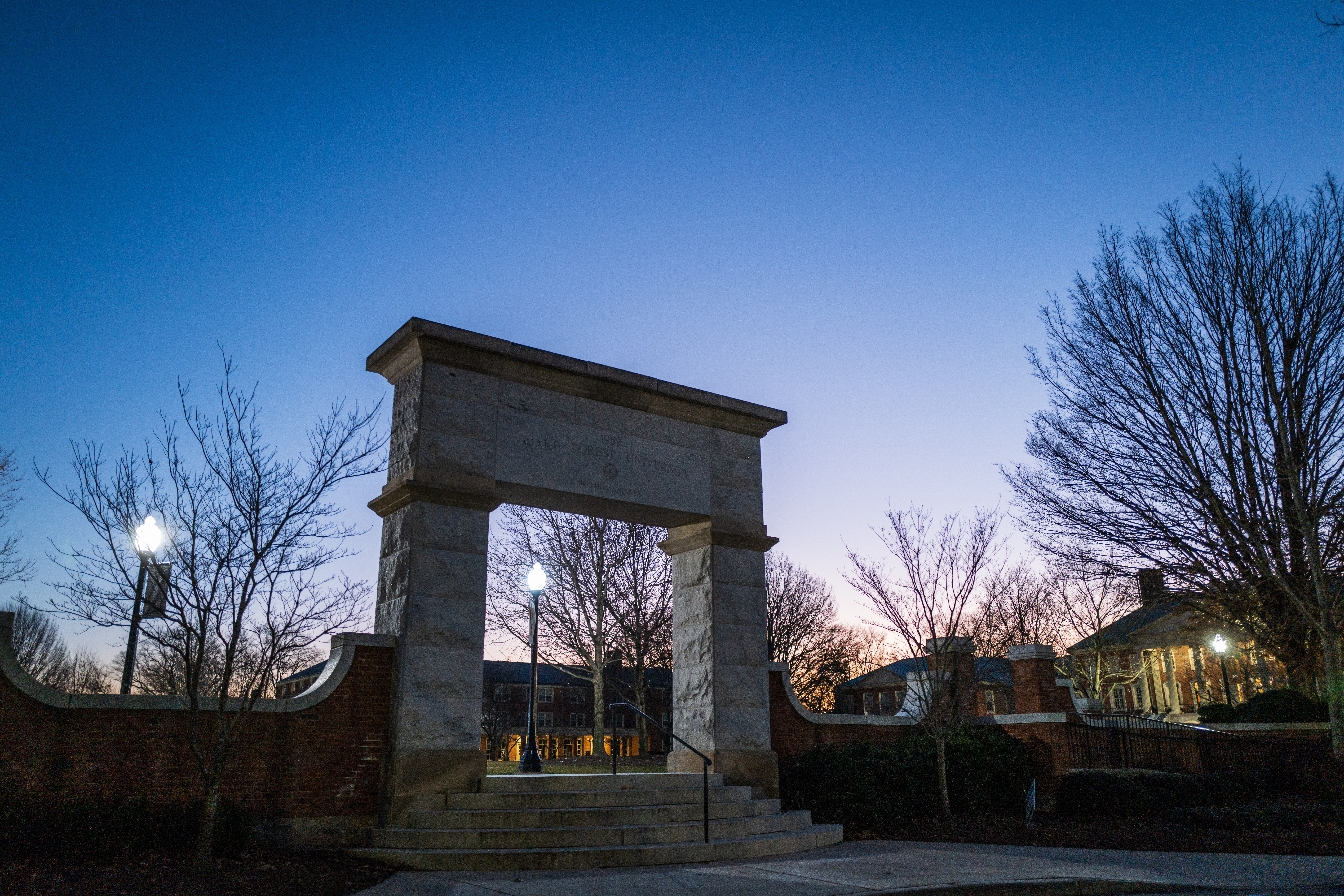 An archway on the Wake Forest campus during evening time.