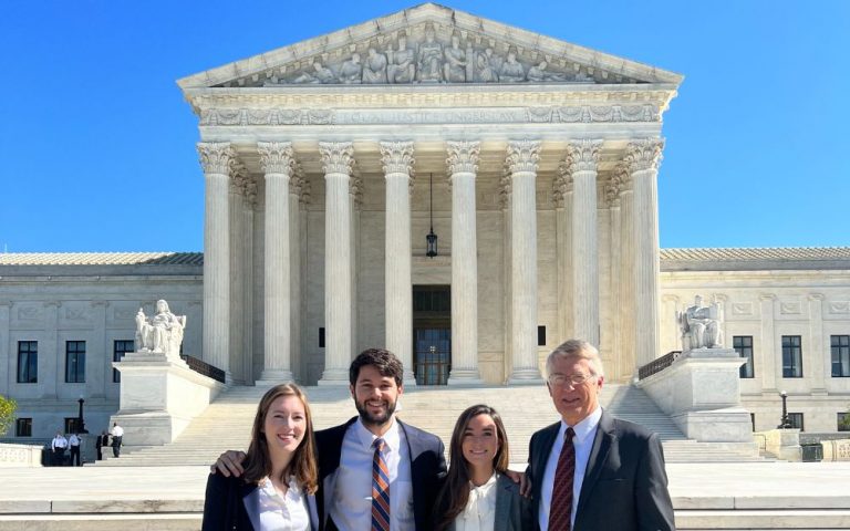 John Korzen with three law school students in Washington, DC.