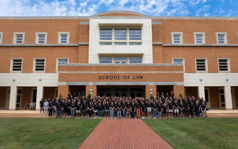 Class of 2025 in front of Worrell Professional Center Building, home to Wake Forest Law.