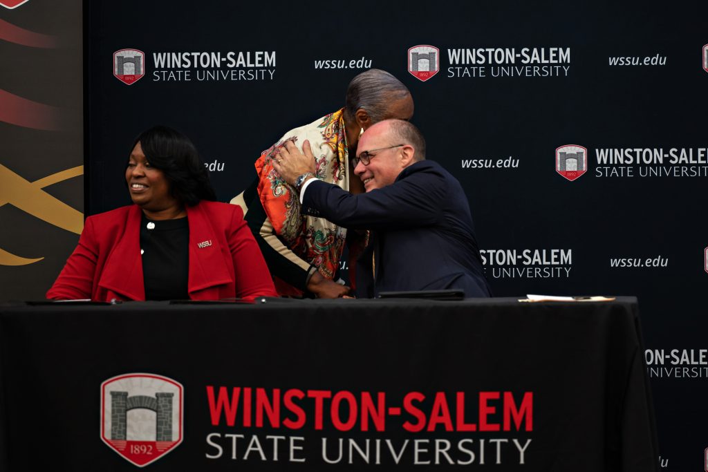 Wake Forest Law Dean Andy Klein embraces Judge Denise Hartsfield