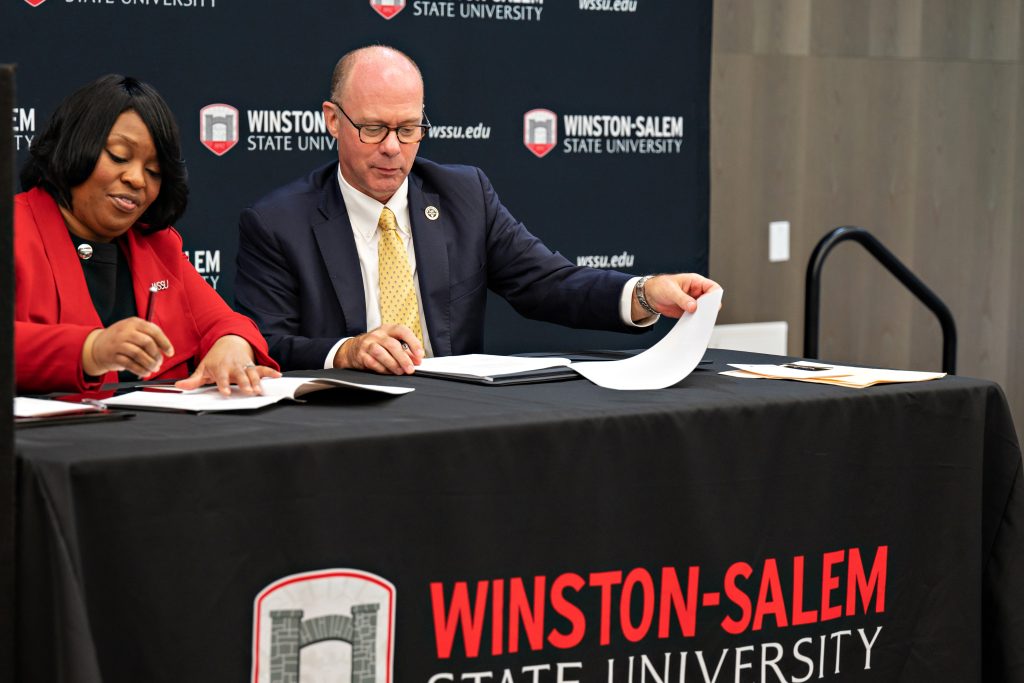 WSSU Chancellor Bonita Brown and Wake Forest Law Dean Andy Klein sign the MOU