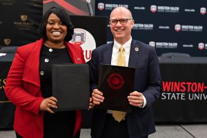 WSSU Chancellor Bonita Brown and Wake Forest Law Dean Andy Klein pose with the signed MOU.