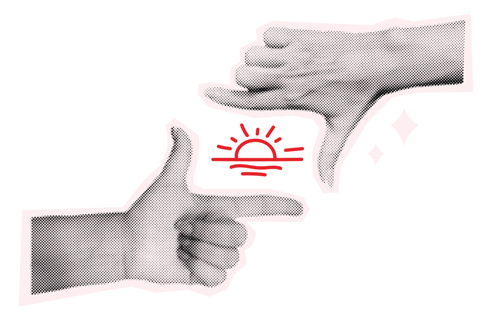 a red drawing of a sunset framed by two hands creating a box around it