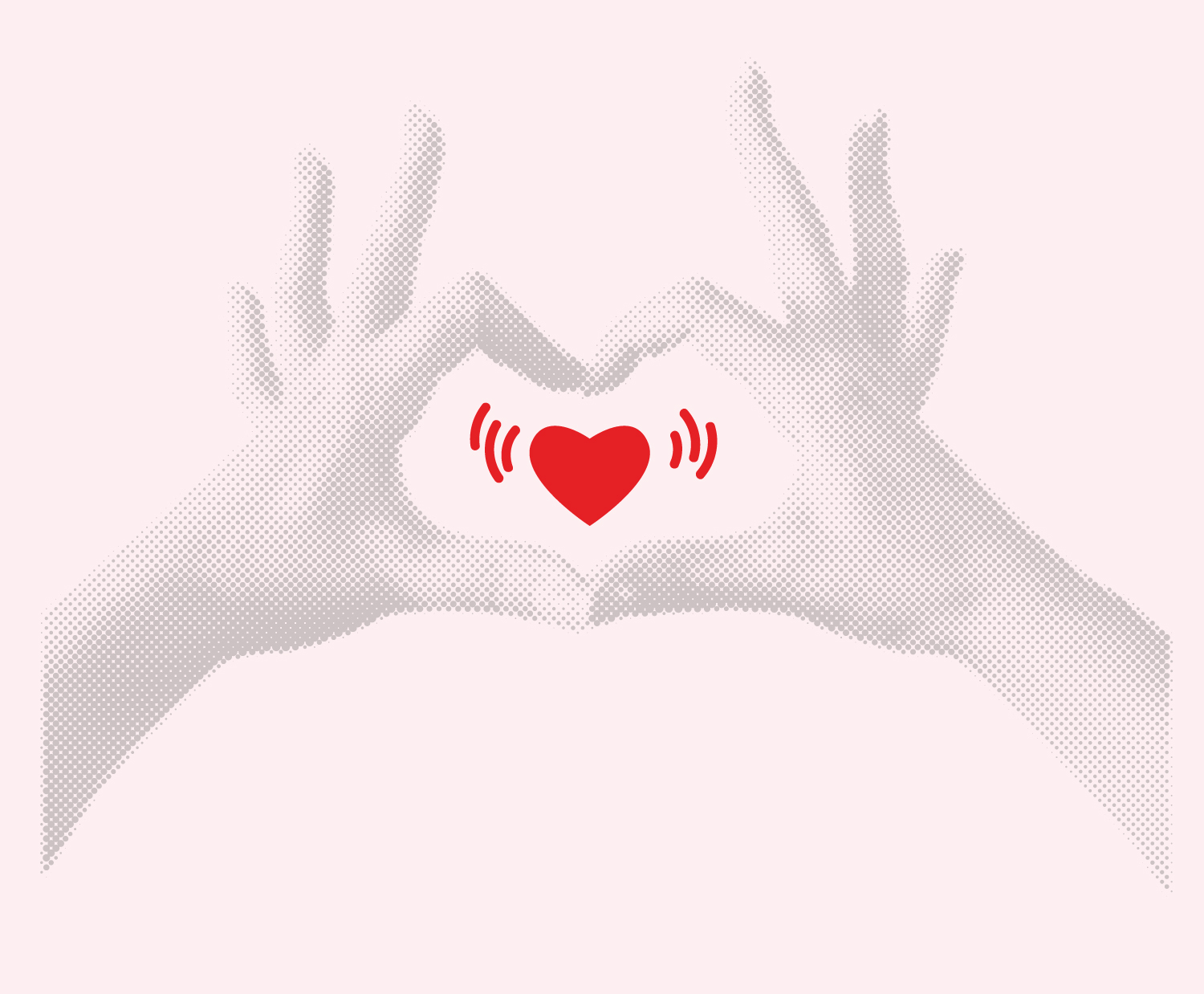 red heart framed by two hands mimicking a heart shape around it