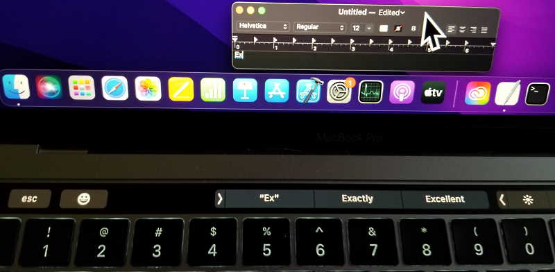 macOS Touch Bar text suggestions and large mouse pointer