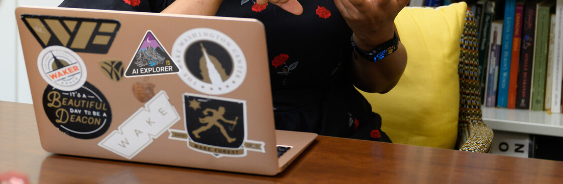 close up of a laptop with the AI Explorer sticker 
