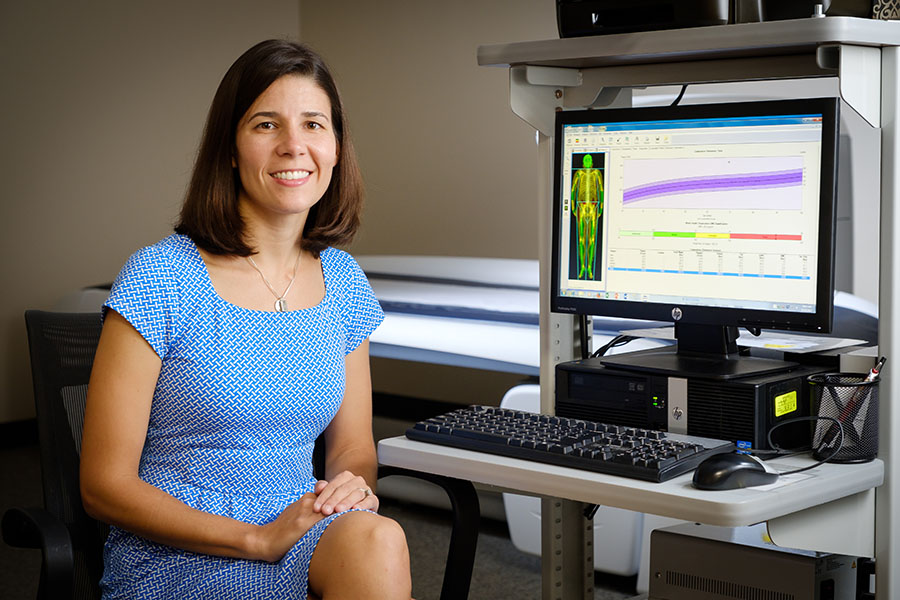 Wake Forest Health and Exercise Science professor Kristen Beavers works in her lab with body composition data