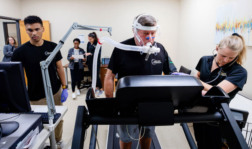 HES graduate students with a participant on the treadmill