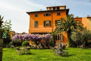 Villa Rossi, an orange building with a courtyard