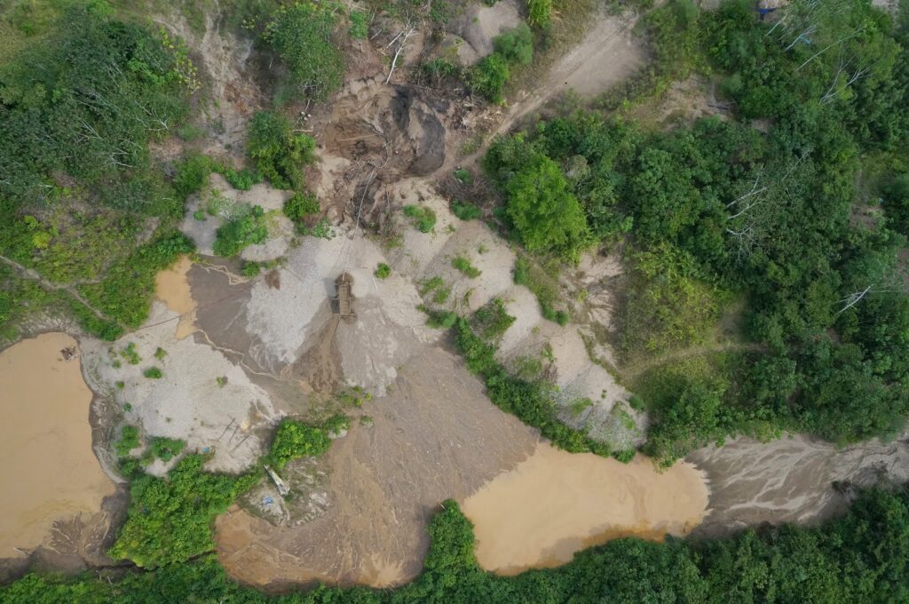 a satellite view of a mosaic of deforested patches in the Amazon