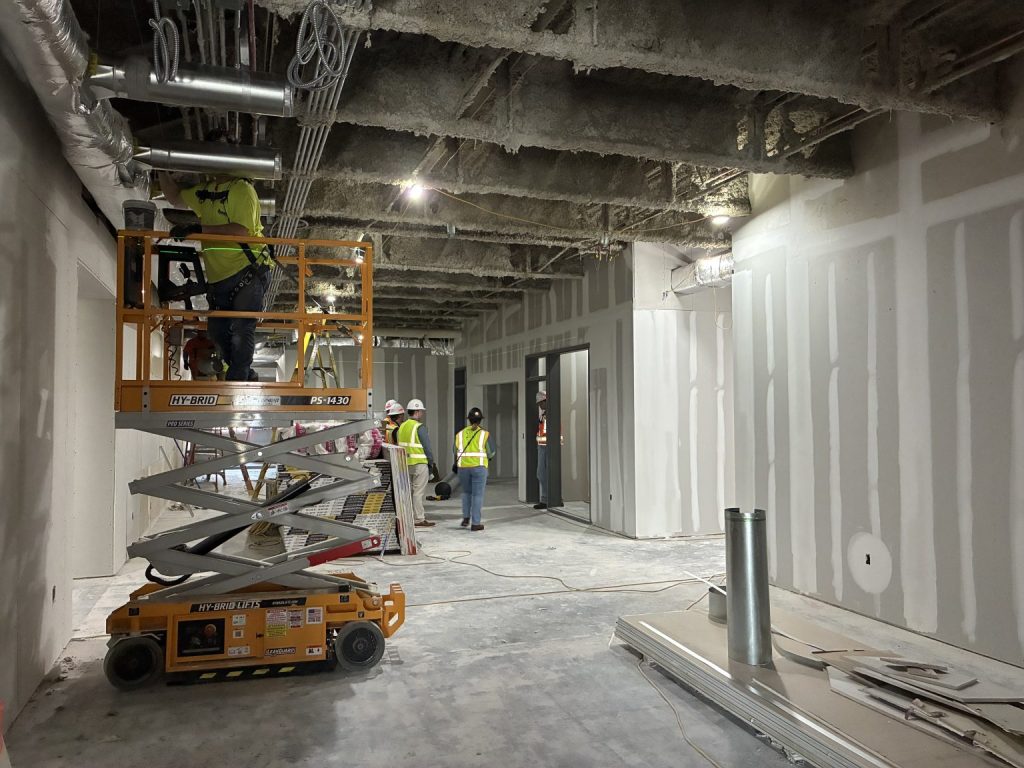 Forklift and workers during the Alumni Hall renovation