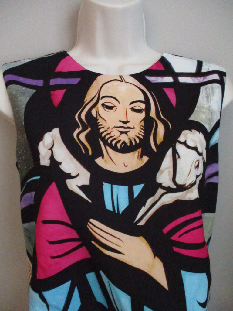 Figure 2: Sleeveless cropped top that features a colorful stained glass image of Jesus as the Good Shepherd.