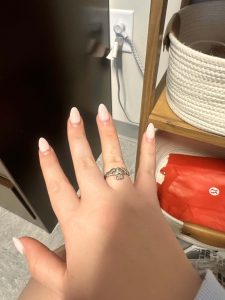 Figure 6: Woman wearing silver Claddagh ring on ring finger of right hand.