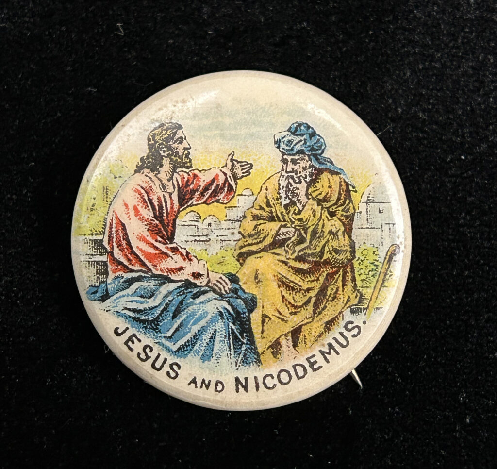 Figure 4: Jesus and Nicodemus pinback button by Whitehead & Hoag. Photo by author.