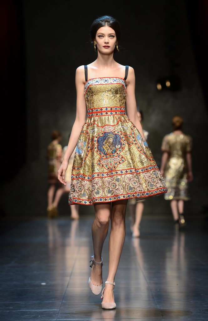 Figure 4: Mosaic-embellished dress from Dolce & Gabbana’s “Tailored Mosaic” collection that features King William II, who initiated building the Cathedral of Monreale. Photography by Pierre Vauthey © Getty Images.