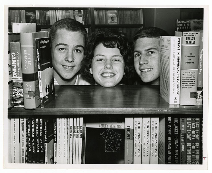 Three WFU Students posing in the library stacks in 1963.