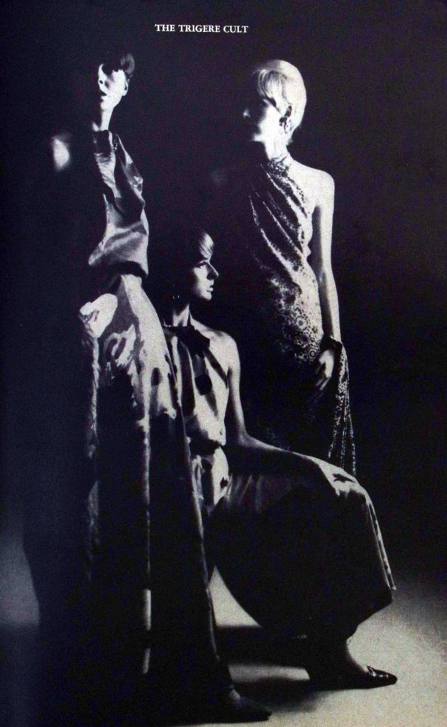 Black and white advertisement of 3 women in dresses designed by Pauline Trigère